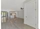 Open living room with tile floors and views into kitchen at 906 E Venice Ave, Venice, FL 34285