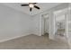 Spacious bedroom with en-suite bathroom and ceiling fan at 906 E Venice Ave, Venice, FL 34285