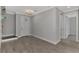 Bright entryway with tile flooring and views to staircase and hallway at 906 E Venice Ave, Venice, FL 34285