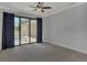 Bright bedroom with sliding doors opening to a private pool area at 906 E Venice Ave, Venice, FL 34285
