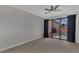 Spacious bedroom with sliding doors leading to the pool at 906 E Venice Ave, Venice, FL 34285