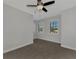 Well-lit bedroom with two windows and carpet flooring at 906 E Venice Ave, Venice, FL 34285