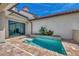 Private plunge pool with brick patio and sliding glass doors at 906 E Venice Ave, Venice, FL 34285