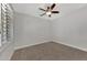 Bright bedroom with carpeted floor and ceiling fan at 906 E Venice Ave, Venice, FL 34285