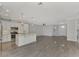 Modern kitchen with white cabinets, stainless steel appliances, and island at 906 E Venice Ave, Venice, FL 34285