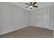 Cozy bedroom with ceiling fan and double doors at 906 E Venice Ave, Venice, FL 34285