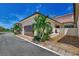 Attached garage with paver driveway and landscaping at 906 E Venice Ave, Venice, FL 34285
