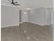 Bright and airy living room with tile flooring, ceiling fan, and views to entry at 906 E Venice Ave, Venice, FL 34285