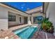 Private plunge pool with brick patio and sliding glass doors at 906 E Venice Ave, Venice, FL 34285