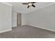 Primary bedroom with door to bathroom and laundry area at 906 E Venice Ave, Venice, FL 34285