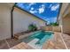 Private plunge pool with brick patio and lush landscaping at 906 E Venice Ave, Venice, FL 34285