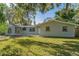 Newly renovated home with a carport and landscaped yard at 403 Pinewood Ave, Nokomis, FL 34275