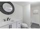 Updated bathroom with white vanity, black fixtures, and a shower/tub combo at 403 Pinewood Ave, Nokomis, FL 34275