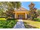 Community center entrance with landscaping and a walkway at 1480 Mossy Oak Dr, North Port, FL 34287