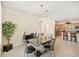 Open concept dining room with kitchen views and modern chandelier at 1480 Mossy Oak Dr, North Port, FL 34287