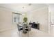 Bright dining room with modern chandelier and table for four at 1480 Mossy Oak Dr, North Port, FL 34287