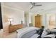 Bright bedroom with ceiling fan and ensuite bathroom access at 1480 Mossy Oak Dr, North Port, FL 34287