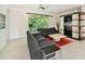 Spacious living room with sectional sofa and large TV at 1480 Mossy Oak Dr, North Port, FL 34287