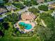 Community pool and clubhouse with lush landscaping at 1480 Mossy Oak Dr, North Port, FL 34287