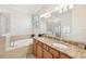 Double vanity bathroom with granite countertop at 1480 Mossy Oak Dr, North Port, FL 34287
