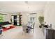 Modern dining room with glass table and black chairs at 1480 Mossy Oak Dr, North Port, FL 34287