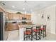 Granite kitchen island with stainless steel appliances at 1480 Mossy Oak Dr, North Port, FL 34287