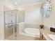 Bathroom boasts a large garden tub and separate shower at 1480 Mossy Oak Dr, North Port, FL 34287