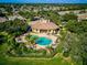 Community pool and clubhouse with lush landscaping at 1480 Mossy Oak Dr, North Port, FL 34287