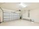 Garage with an open garage door and extra space at 1480 Mossy Oak Dr, North Port, FL 34287