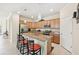Kitchen island with granite countertop and breakfast bar seating at 1480 Mossy Oak Dr, North Port, FL 34287