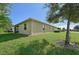 House exterior showcasing side yard and landscaping at 1480 Mossy Oak Dr, North Port, FL 34287