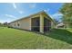 House exterior with a screened porch and yard at 1480 Mossy Oak Dr, North Port, FL 34287