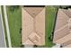 Top-down view of a single-story house and surrounding homes at 1480 Mossy Oak Dr, North Port, FL 34287