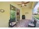 Relaxing screened porch with patio furniture at 1480 Mossy Oak Dr, North Port, FL 34287