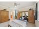 Bedroom with ensuite bathroom and built-in wood cabinets at 1480 Mossy Oak Dr, North Port, FL 34287