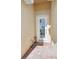 White front door with glass panels and brick walkway at 1480 Mossy Oak Dr, North Port, FL 34287