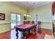 Community game room features a pool table and comfortable seating at 1480 Mossy Oak Dr, North Port, FL 34287