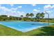 Blue basketball court with seating area under a covered pavilion at 5873 Bungalow Grove Ct, Palmetto, FL 34221