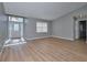 Spacious living room with vinyl flooring, gray walls, and an entryway at 13592 Clara Ln, Port Charlotte, FL 33981