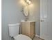 Updated bathroom with light wood vanity, white toilet, and a mirror at 13592 Clara Ln, Port Charlotte, FL 33981