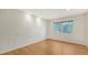 Bright bedroom with wood flooring and large windows at 875 Indian Beach Dr, Sarasota, FL 34234