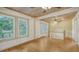 Charming bedroom with hardwood floors and a ceiling fan at 875 Indian Beach Dr, Sarasota, FL 34234