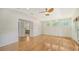 Main bedroom with hardwood floors and access to en-suite bathroom at 875 Indian Beach Dr, Sarasota, FL 34234