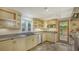 Kitchen with stainless steel appliances and light wood cabinets at 875 Indian Beach Dr, Sarasota, FL 34234