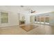 Spacious living room with fireplace and access to backyard at 875 Indian Beach Dr, Sarasota, FL 34234