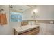 Modern bathroom with double vanity and stone-detailed walls at 875 Indian Beach Dr, Sarasota, FL 34234