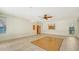 Living room with fireplace, ceiling fan and access to backyard at 875 Indian Beach Dr, Sarasota, FL 34234