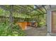 Outdoor patio area with pergola and built-in grill at 875 Indian Beach Dr, Sarasota, FL 34234
