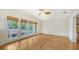 Bright bedroom with hardwood floors and a ceiling fan at 875 Indian Beach Dr, Sarasota, FL 34234