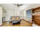 Small bedroom with a sofa, shelving and wood floors at 875 Indian Beach Dr, Sarasota, FL 34234